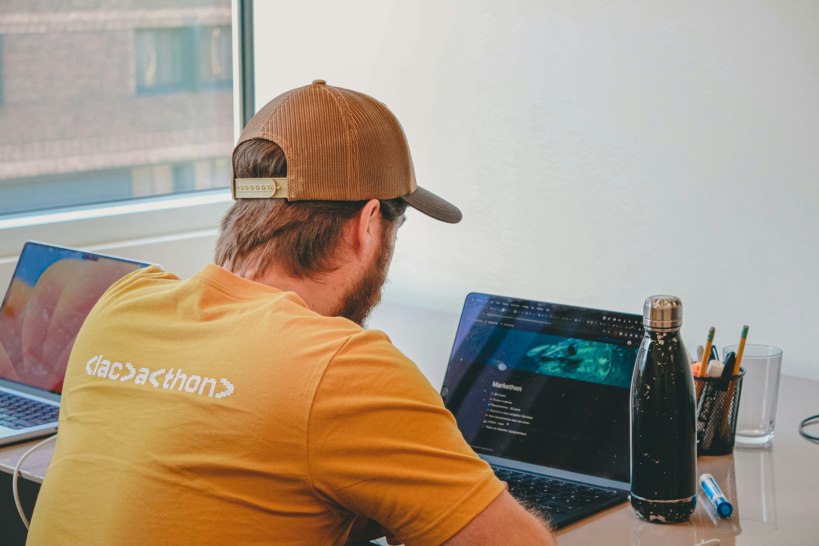 Developer writing code on a laptop